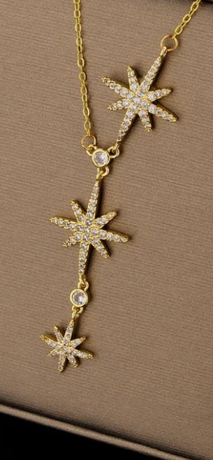 collier doré Tat